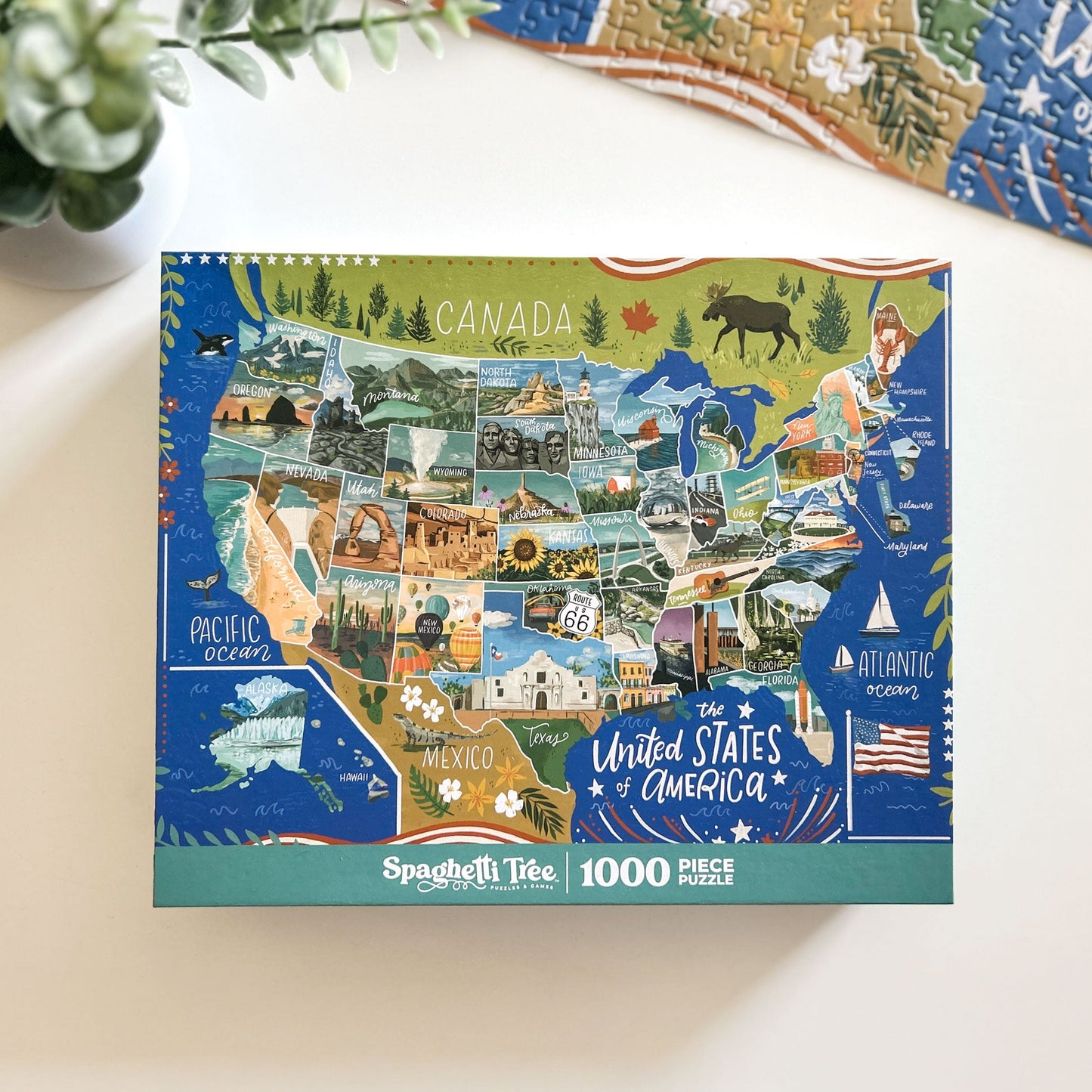 Map-themed puzzle box with illustrations of the United States on a white surface.